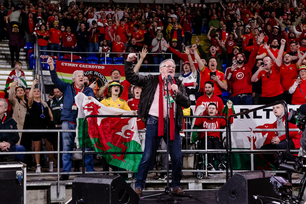 CARDIFF, WALES - 24 MARCH 2022: Dafydd Iwan performs Yma O Hyd during the 2022 FIFA World Cup play-off semi-final between Cymru &amp; Austria at the Cardiff City Stadium on the 24th of March 2022. (Pic by John Smith/FAW)